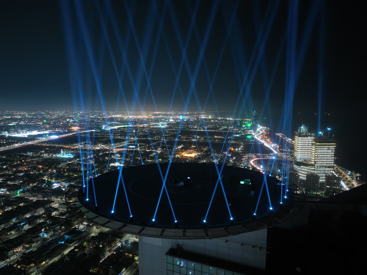 The Headquarters tower in Jeddah at night, its circular lighting landmark glowing above the city for Saudi National Day.